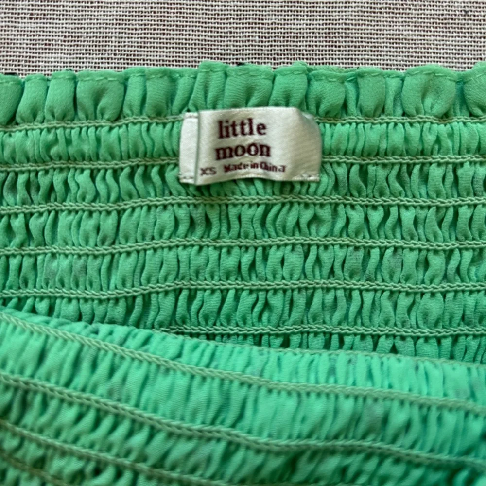 Aritzia green cropped chiffon top.